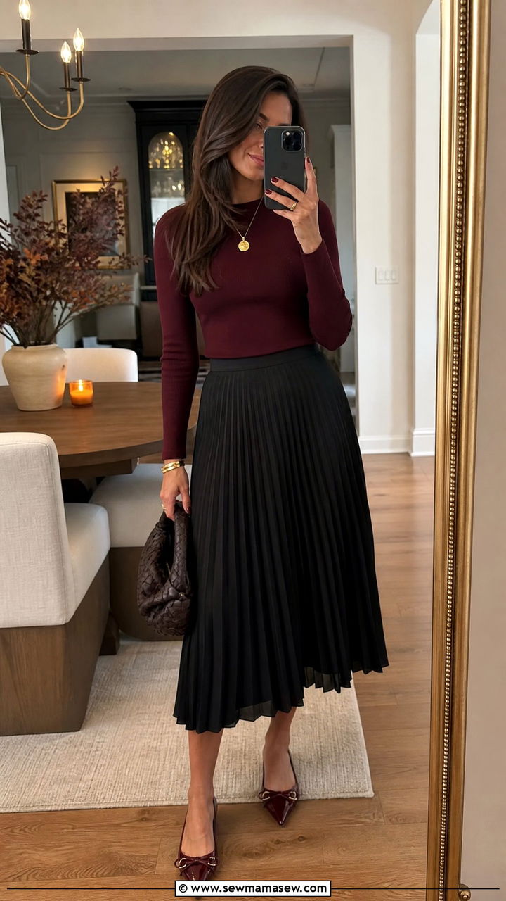 Burgundy top with pleated black midi skirt outfit - 25 Outfit ideas for women over 40 casual 2026