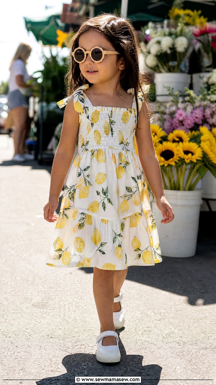 Girl smocked cotton sundress with Mary Jane sneakers vacation outfit - 30 Kids vacation outfit ideas