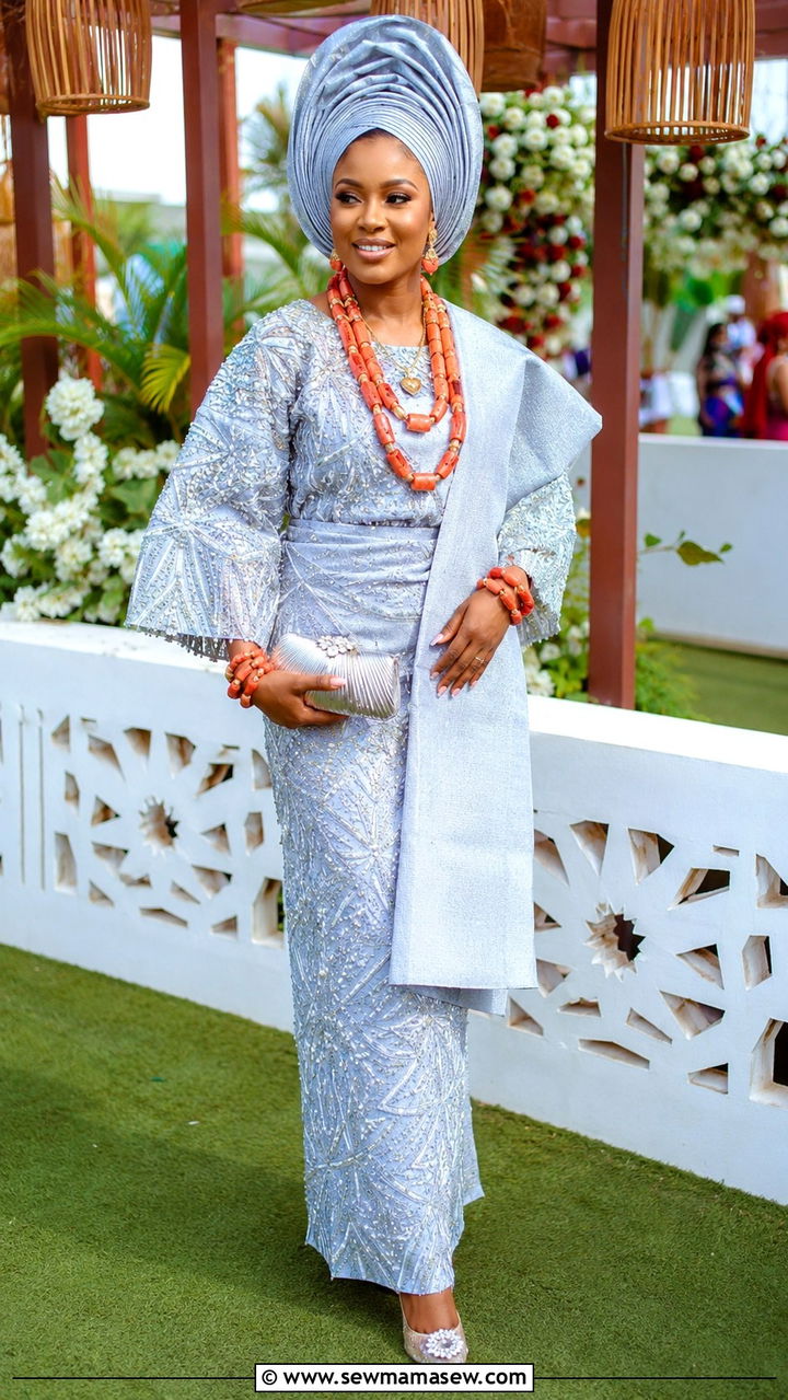 Iro And Buba In Beaded Lace With Coral Accessories - 25 Wedding guest outfit ideas Nigerian wedding