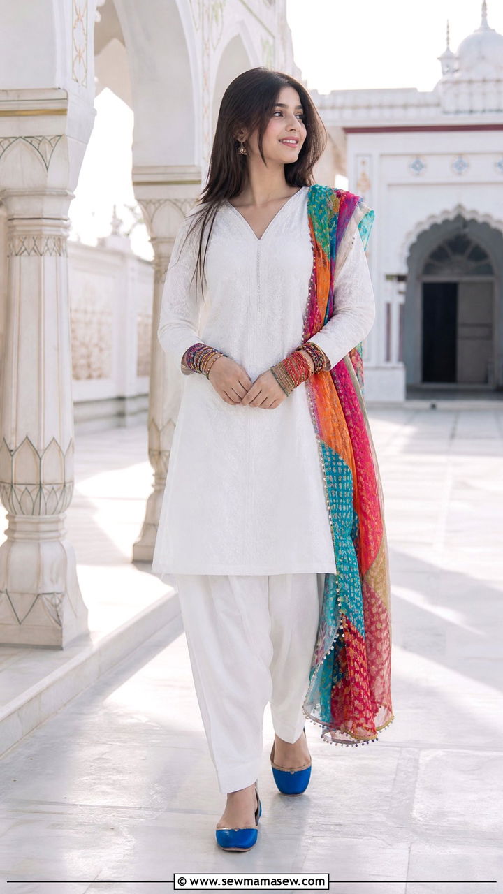 White Shalwar Kameez with Contrasting Khusas - 30 Eid outfit ideas for teens